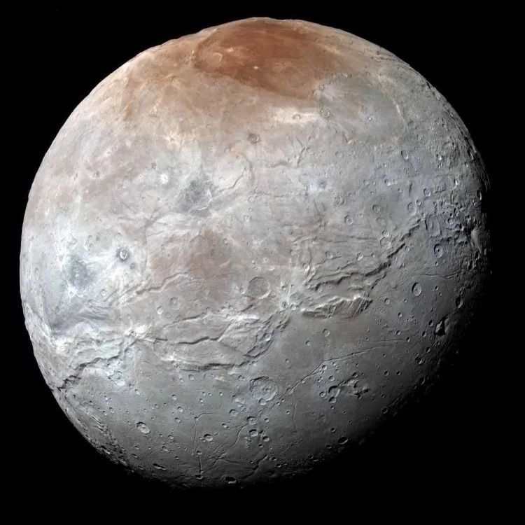 False-color image of Charon using red, blue, and infrared filters to highlight specific surface features. (Credit: NASA/JPL-JHU/SWRI)