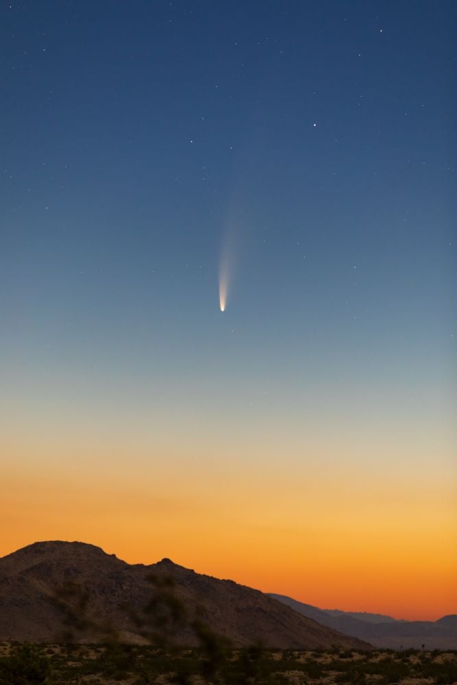 This photo of comet C/2020 F3 NEOWISE was taken in July 2020. There's no doubt that comets have struck Earth in the past, and some have exploded in the air above the surface. One of these exploding comets could've triggered the Younger Dryas, bringing and end to the Clovis culture and wiping out megafauna. Image Credit: By Dbot3000 - Own work, CC BY-SA 4.0, https://commons.wikimedia.org/w/index.php?curid=92032148