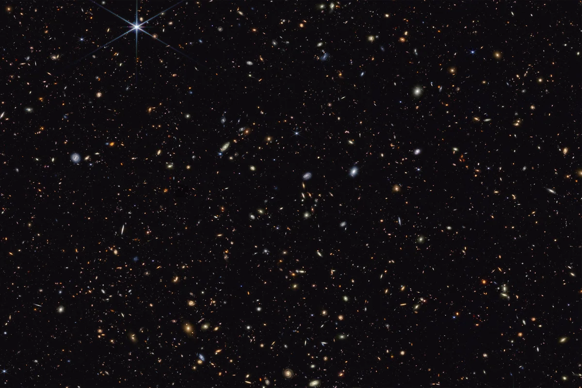 The most distant galaxies ever imaged by the JWST appear as small, reddish blobs in this image. Credit: NASA/ESA/CSA/STScI