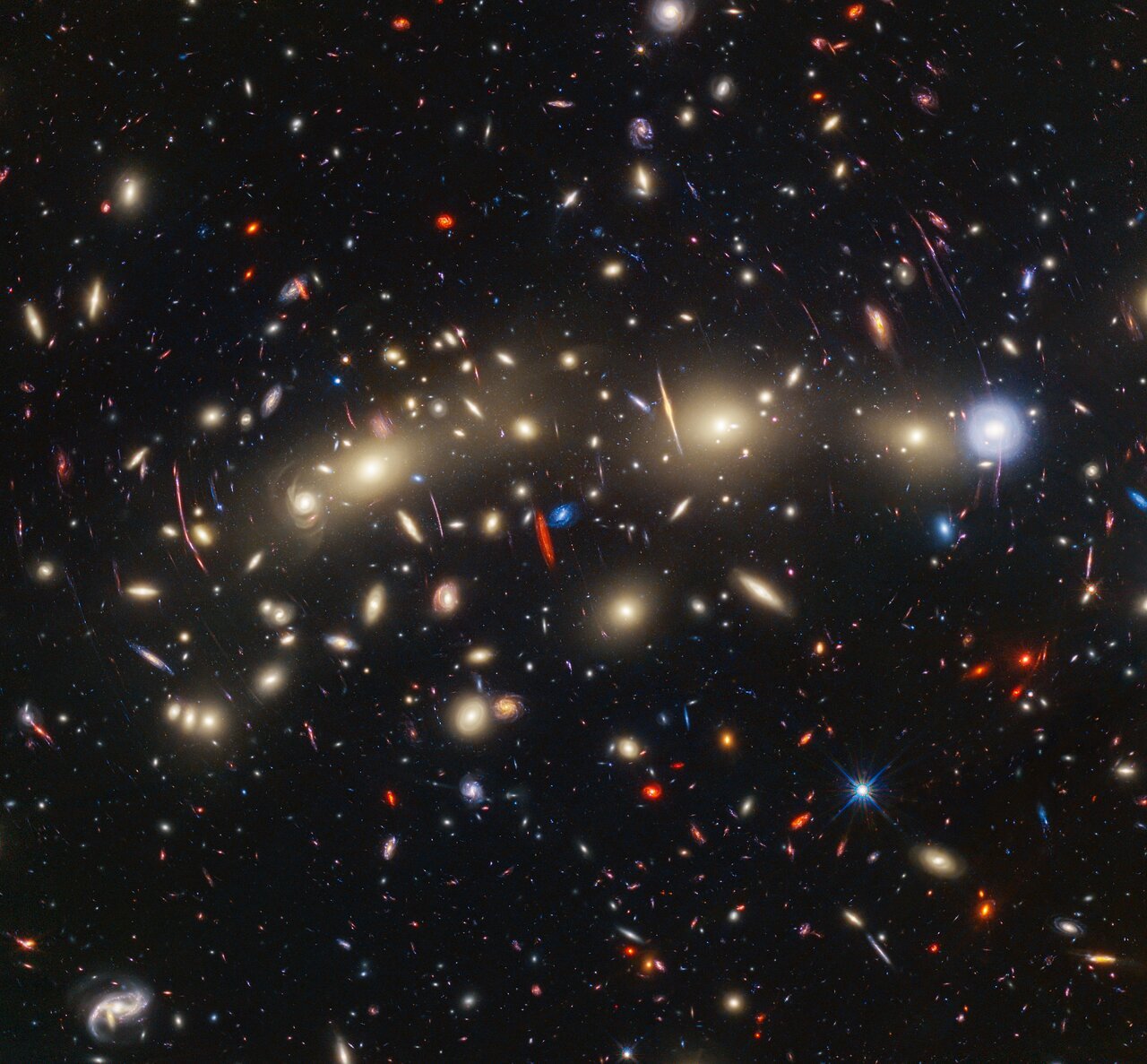 Composite image of a cluster of galaxies from Hubble and Webb. Credit - NASA, ESA, CSA, STScI, J. Diego (Instituto de Física de Cantabria, Spain), J. D’Silva (U. Western Australia), A. Koekemoer (STScI), J. Summers & R. Windhorst (ASU), and H. Yan (U. Missouri)
