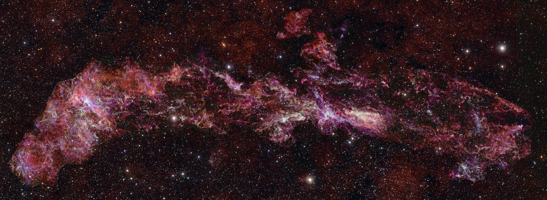 The largest image of the Milky Way's center, captured by the ESO's ALMA array. Credit: ALMA (ESO/NAOJ/NRAO)/S. Longmore et al./ESO/D. Minniti et al.(background)