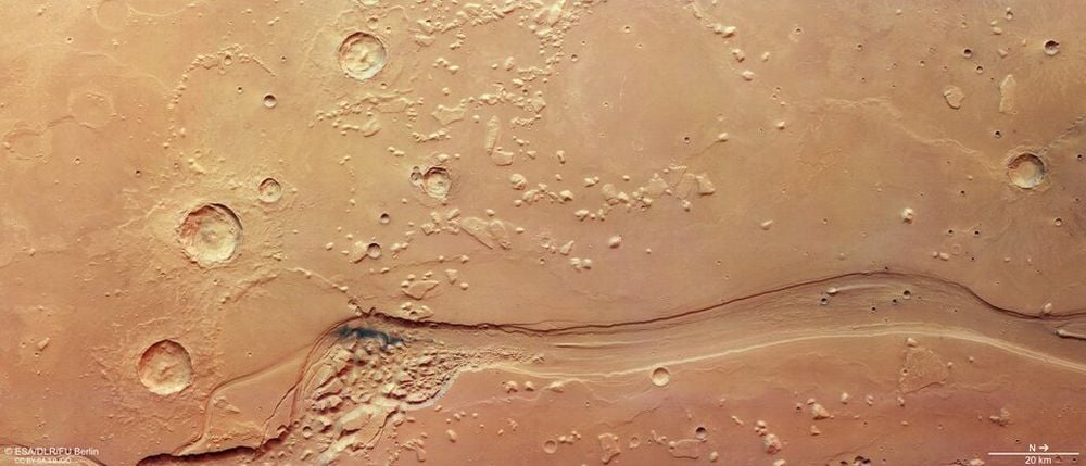 This image from the ESA's Mars Express Orbiter shows the beginning of Shalbatana Vallis, and ancient water channel on Mars. It begins in jumbled chaos terrain in Orson Welles crater and extends for 1300 km across the Martian surface. Image Credit: ESA/DLR/FU Berlin. LICENCE:
CC BY-SA 3.0 IGO or ESA Standard Licence