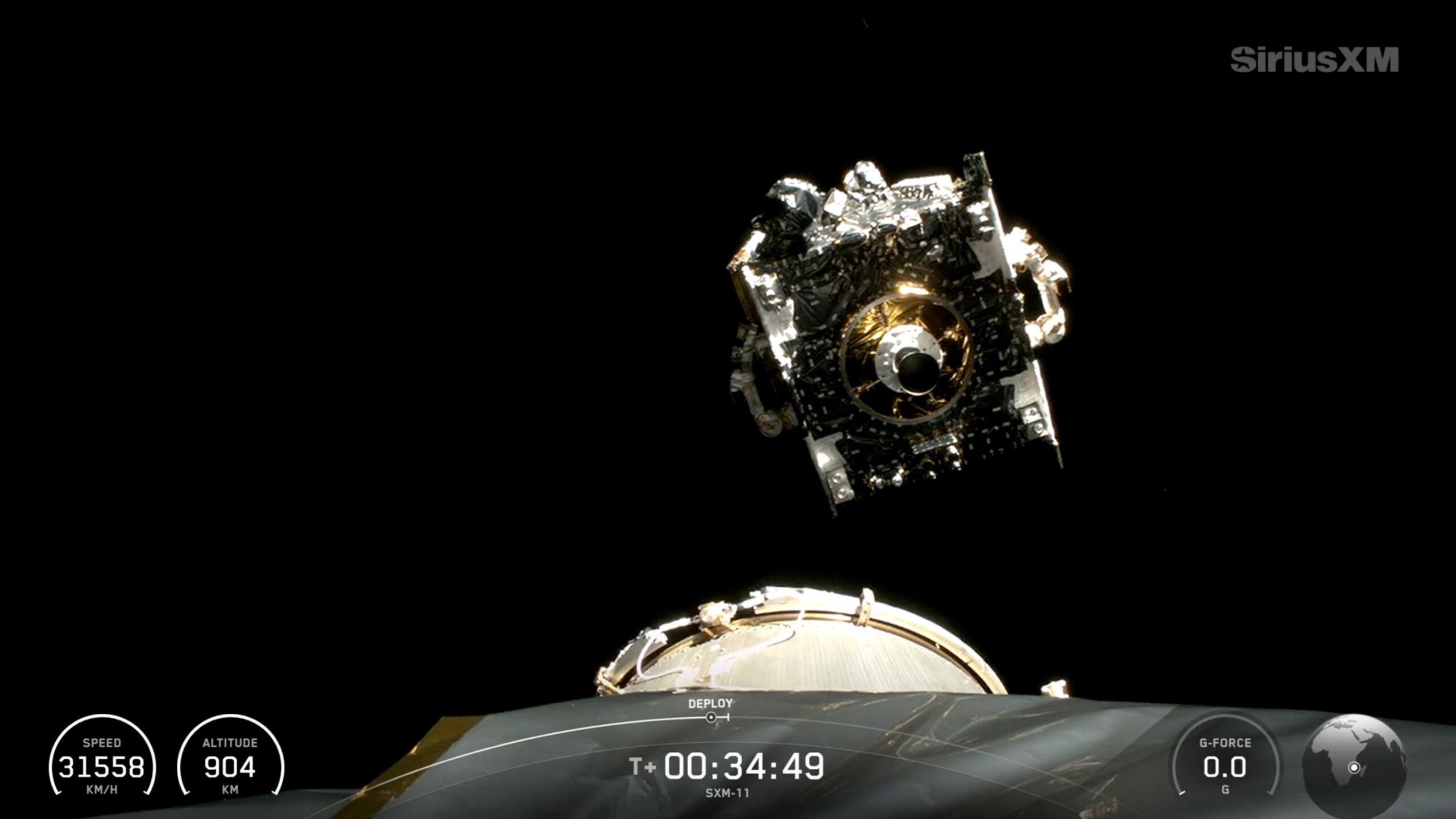view from a rocket's upper stage showing a cubical spacecraft deploying into space
