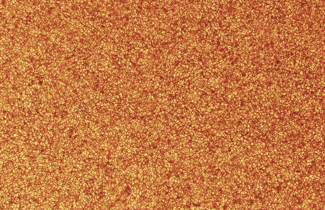 Granulation on the Sun's surface, the tops of convective cells that ferry energy upward after its long crawl through the solar interior. Credit: Wikimedia Commons (CC BY 4.0).