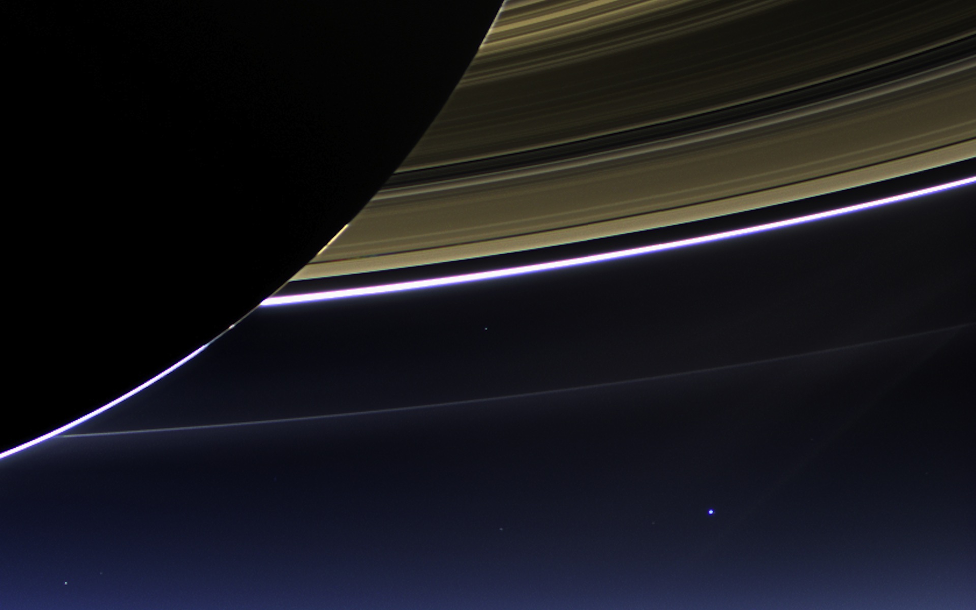 This rare space wallpaper taken on July 19, by NASA's Cassini spacecraft shows Saturn's rings and our planet Earth and its moon in the same frame. 