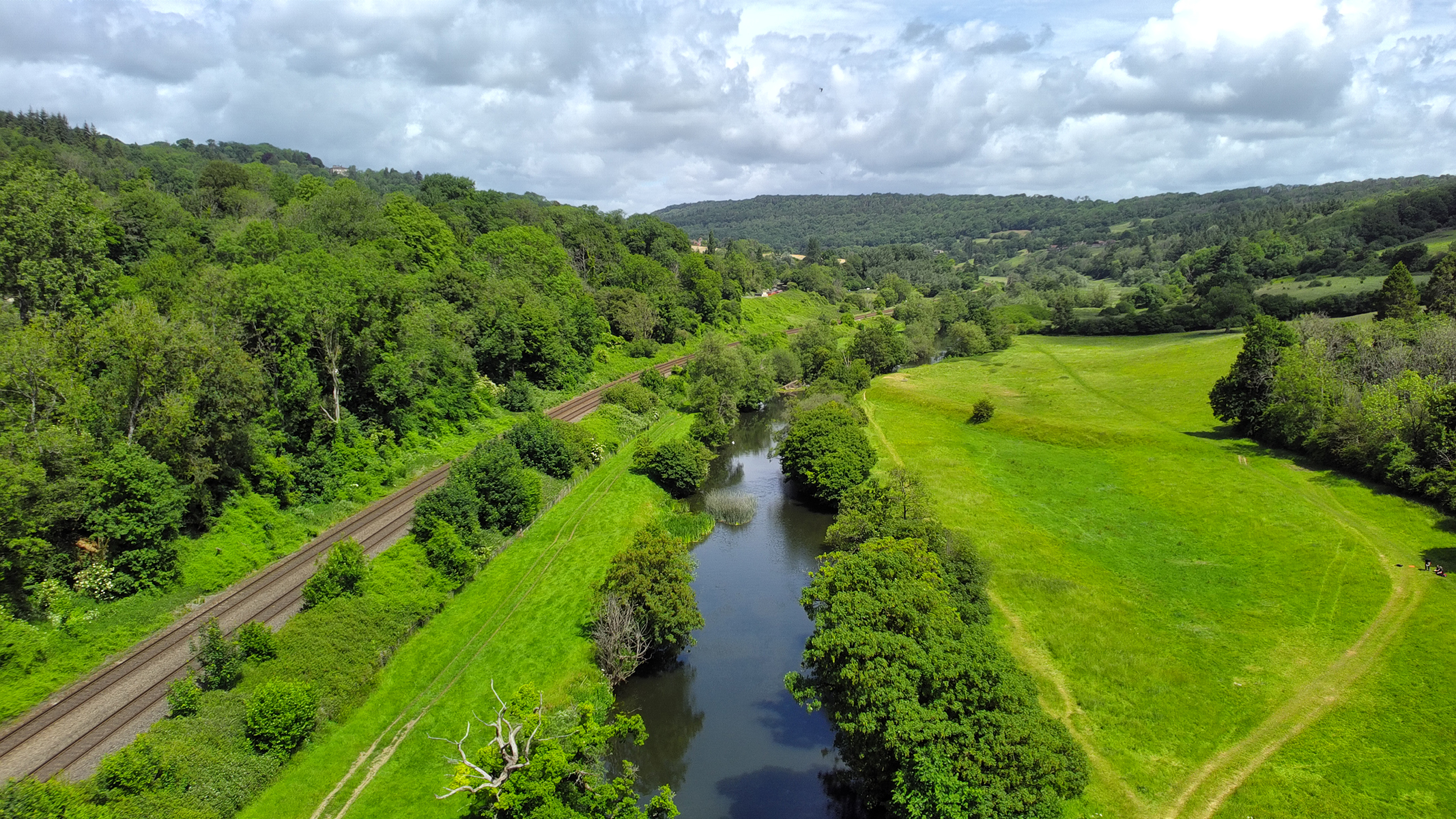 Photo of a river and verdant fields taken with the Holy Stone HS900 Pro