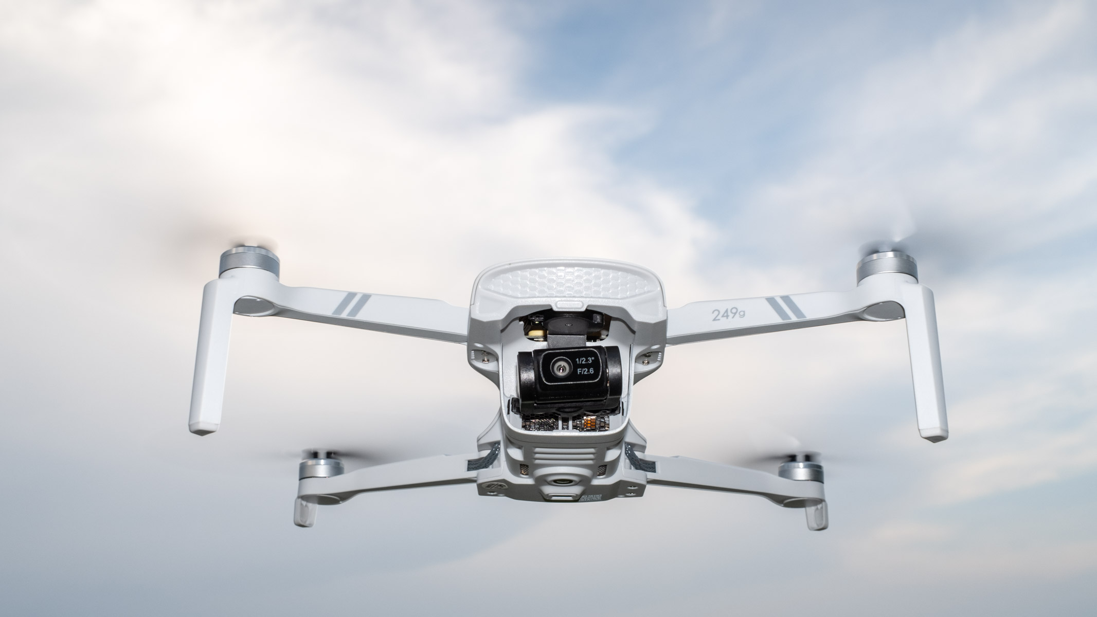 Holy Stone HS900 in flight against a cloudy sky