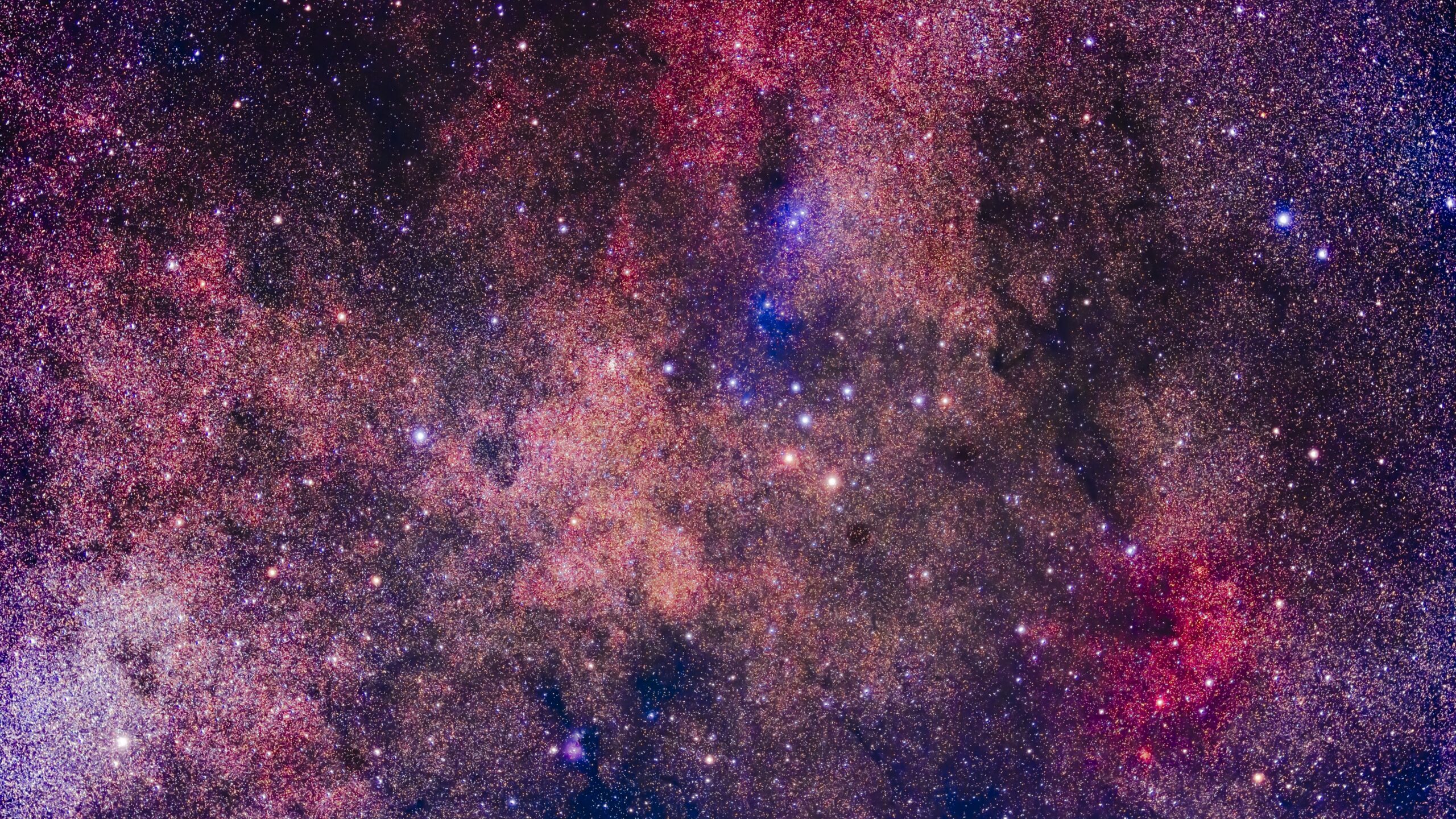 deep space image showing vast amount of colourful stars and rich nebula structures.
