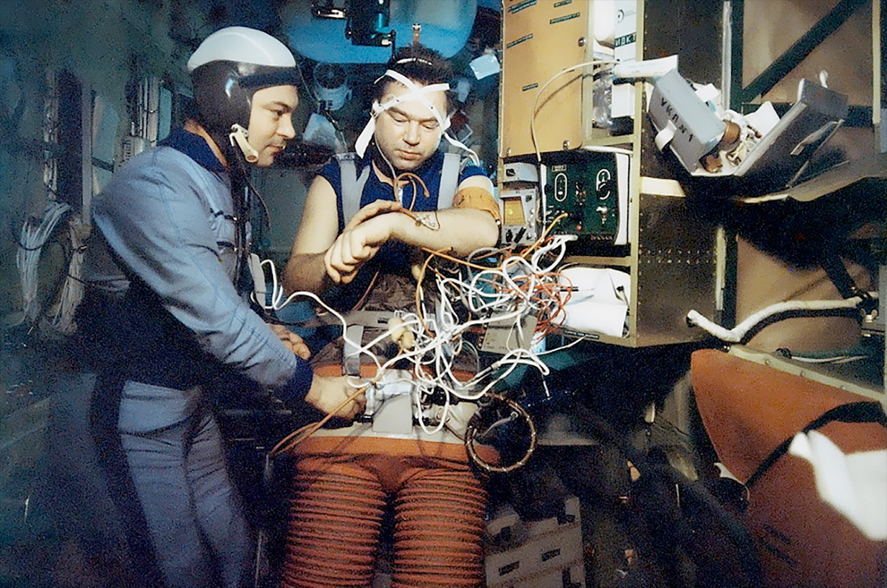 Soyuz 26 crewmates Yuri Romanenko and Georgi Grechko are seen as members of the Salyut 6 space station's first long-duration crew.