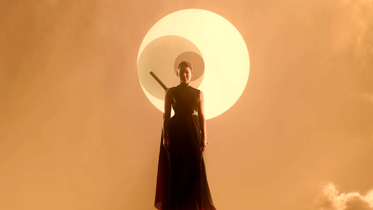 a woman floats in the air in front of a star and two moons