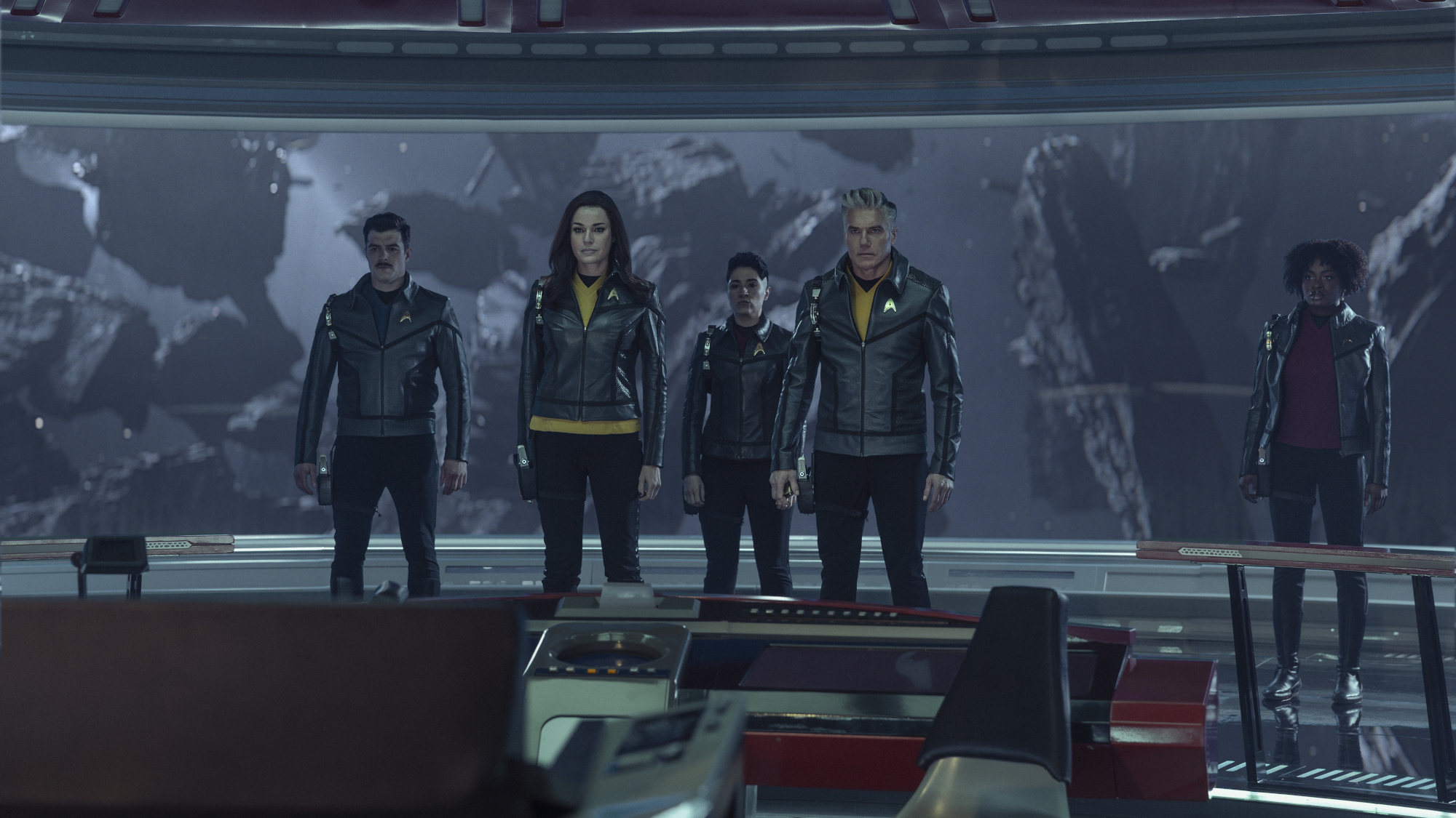 (L-R): Dan Jeannotte as Sam Kirk, Rebecca Romijn as Una, Melissa Navia as Erica Ortegas, Anson Mount as Captain Pike, and Celia Rose Gooding as Uhura in season 4, episode 2, of Star Trek: Strange New Worlds