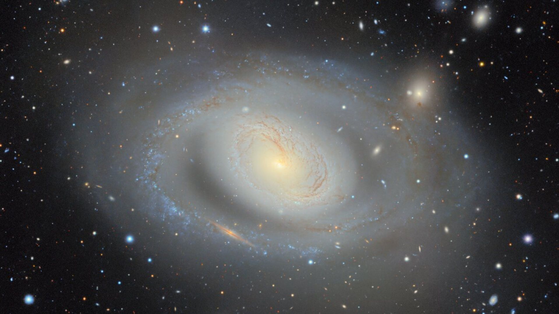 A large galaxy almost fills the screen. It's a spiral and very glowy and hazy.