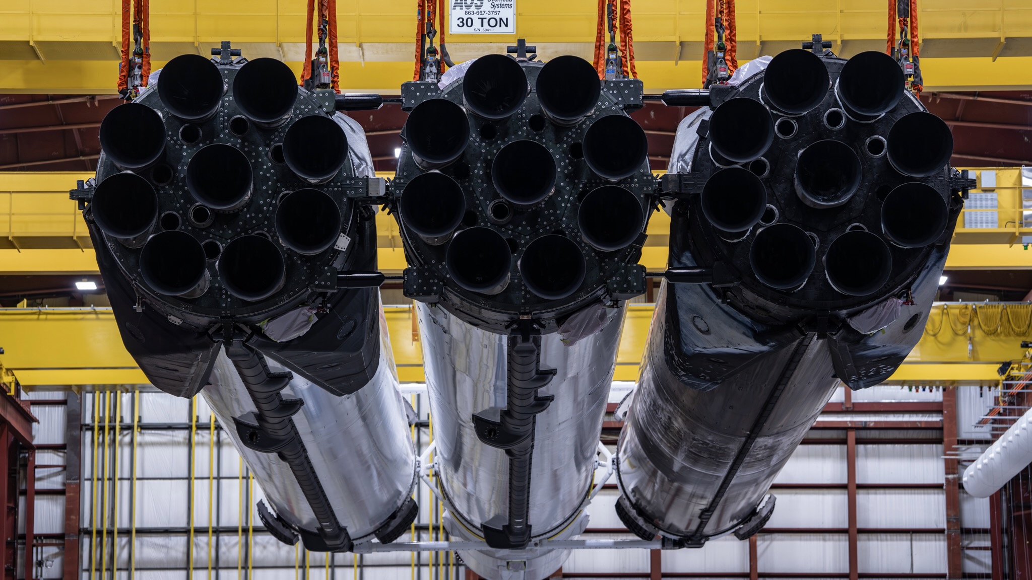 The three first-stage boosters of the Falcon Heavy rocket that will launch NASA's Nancy Grace Roman Space Telescope on Aug. 30, 2026. SpaceX shared this photo via X on Aug. 26.
