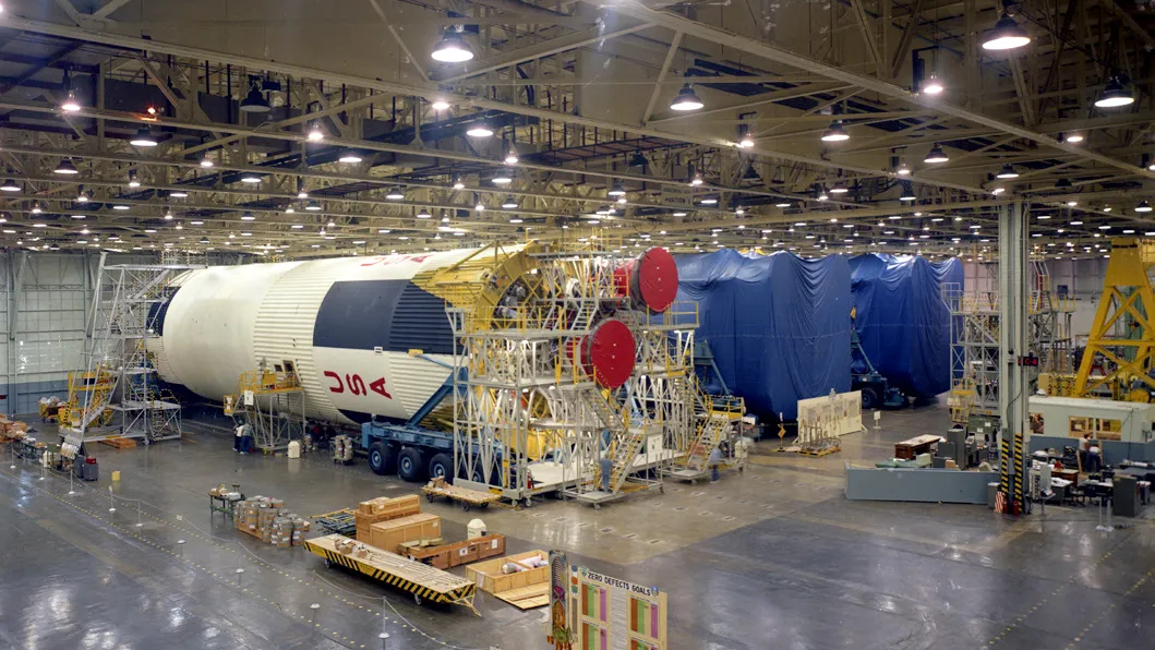 Giant rocket stages for NASA's Saturn V moon rocket are assembled at the Michoud Assembly Facility.