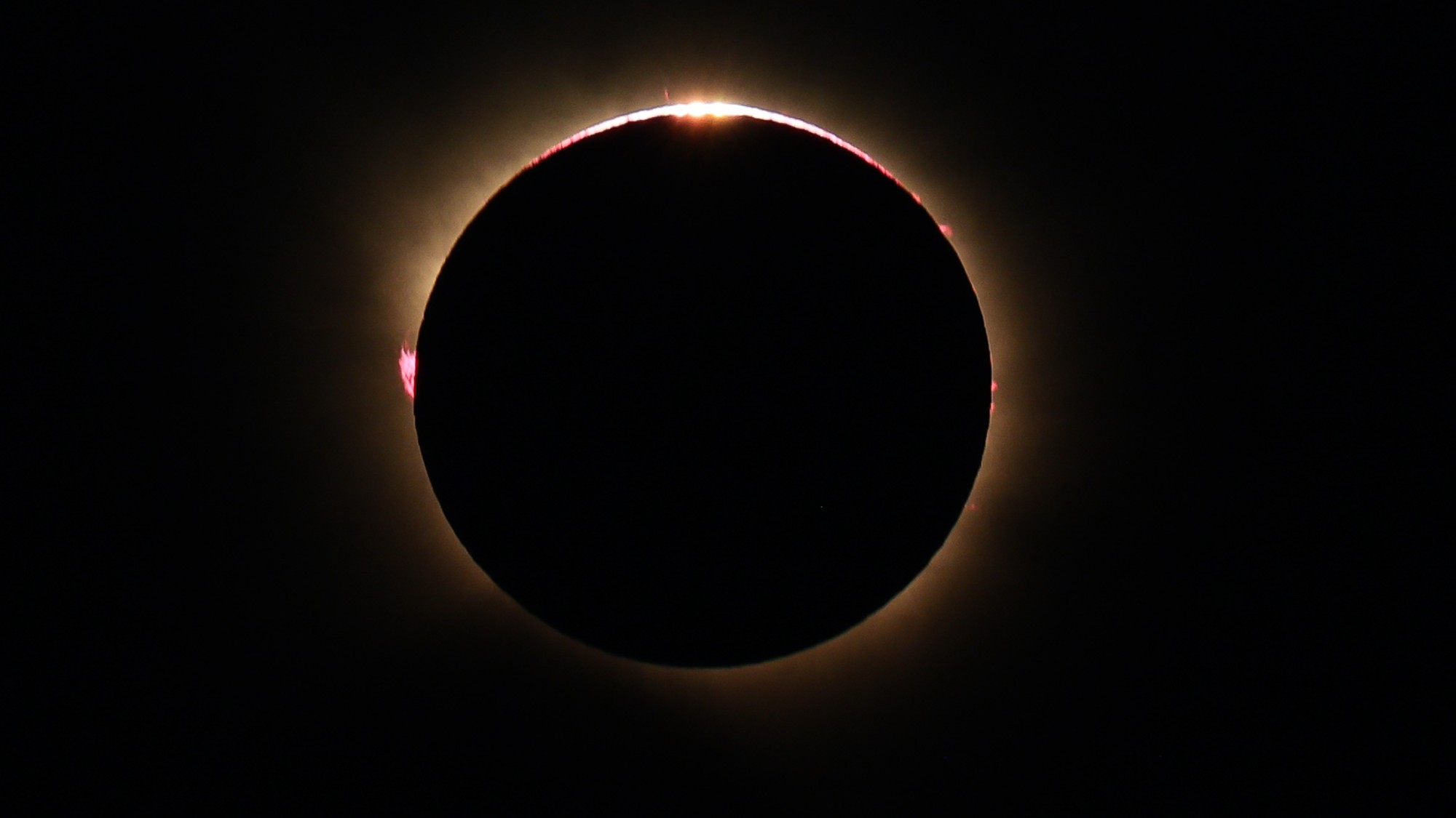 a bright ring of light on a black background