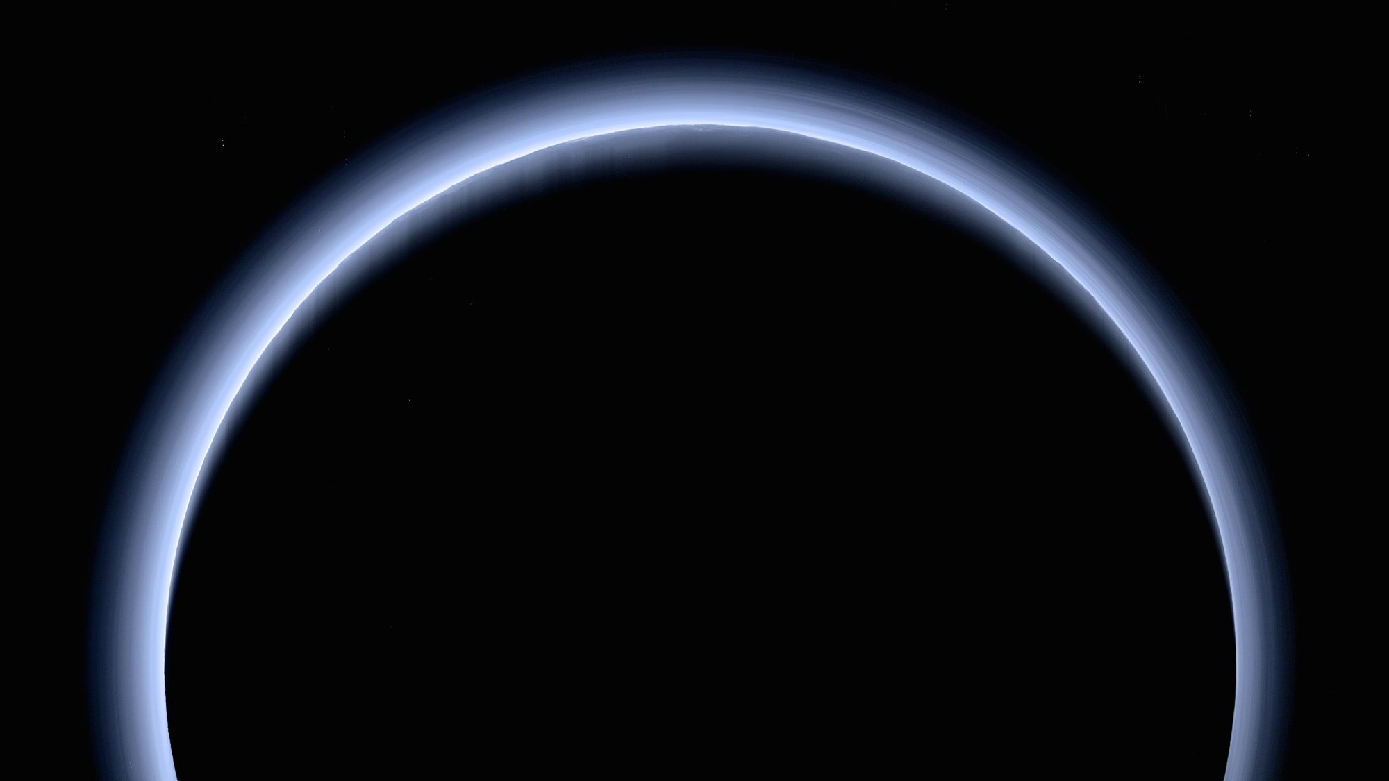 a hazy blue ring of light on a black background