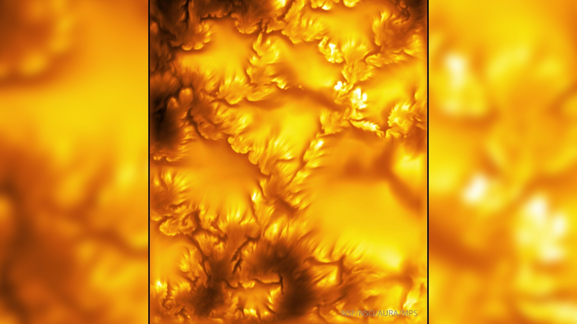 Yellow and orange swirls show the sun in sharp detail.