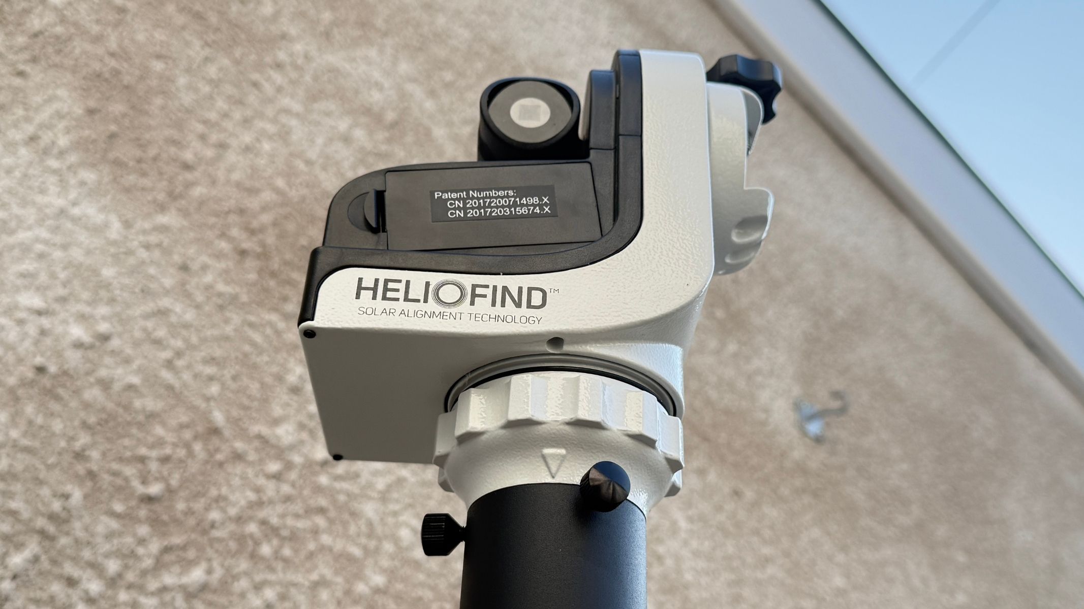 A close-up of the Sky-Watcher SolarQuest solar telescope mount, showing text reading 'HelioFind' along the side of it.
