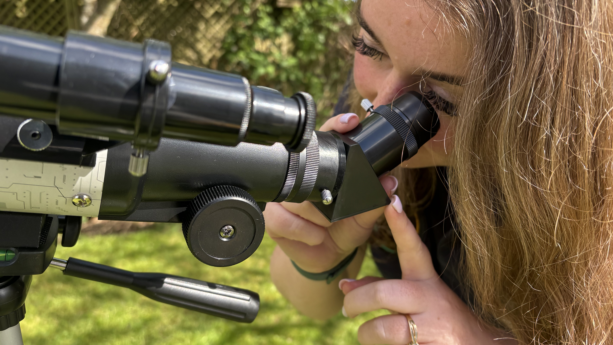 Author Gemma Lavender with a Celestron Moon Mission Travel Scope 70.