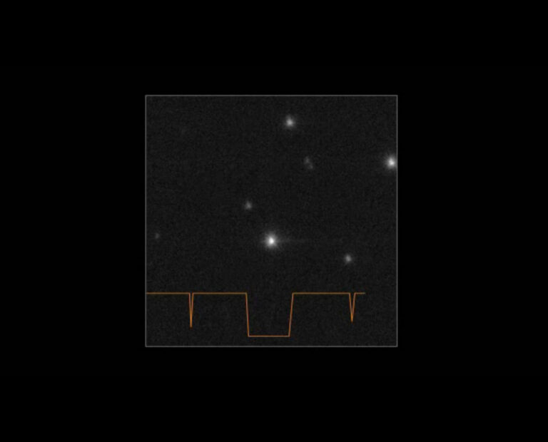 A black square with a lighter grey square inside it with a jagged orange line running across its base