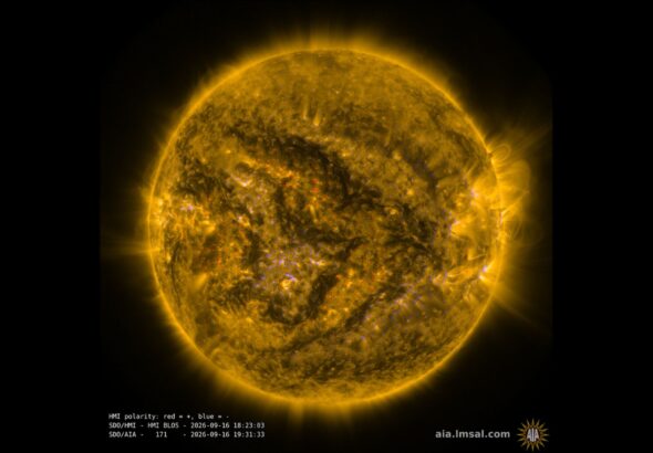 A view of a yellow sphere with some flares coming off of it.