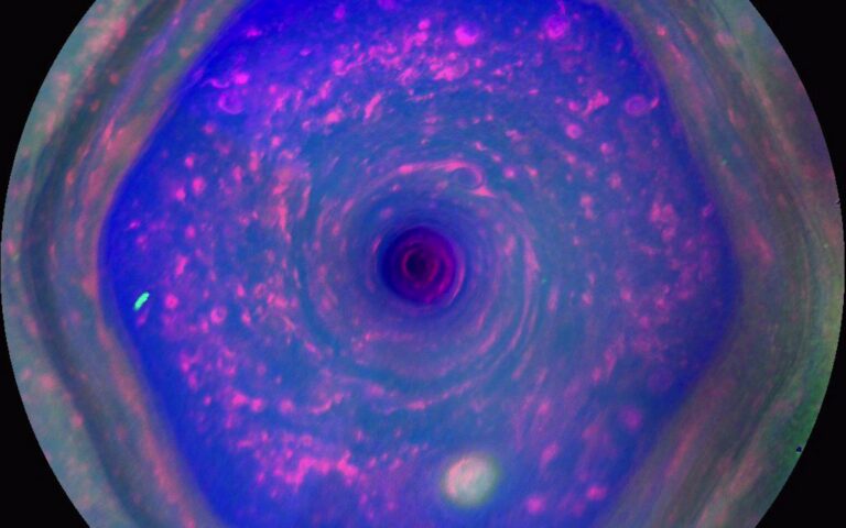 a blue swirling hexagon on a grey orb