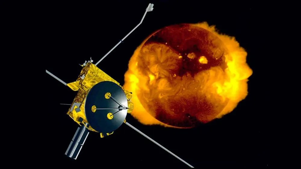 An illustration shows a boxy, gold-foil-wrapped spacecraft with a large black dish antenna on the left, positioned in front of a glowing, fiery sphere on the right against a solid black space background. The central sun-like orb ranges in color from dark, swirling reddish-browns to intense, bright yellow flare-like bursts around its edges. Several thin, metallic booms and antenna rods extend outward diagonally from the main body of the satellite, creating strong geometric contrast with the soft, fiery texture behind it.