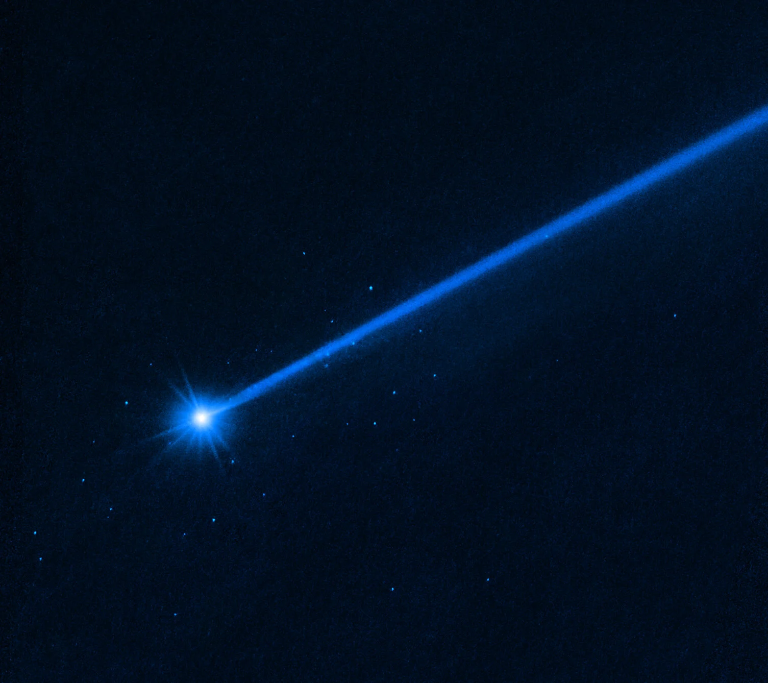 Hubble spies a debris stream from the asteroid pair, post-DART impact. Credit: NASA/HST/STScI.