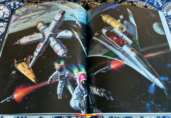 an open book with pages depicting space art