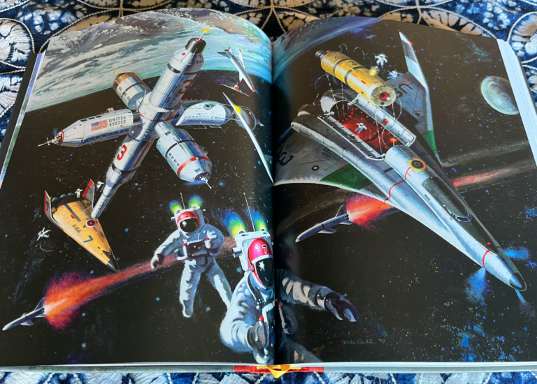 an open book with pages depicting space art