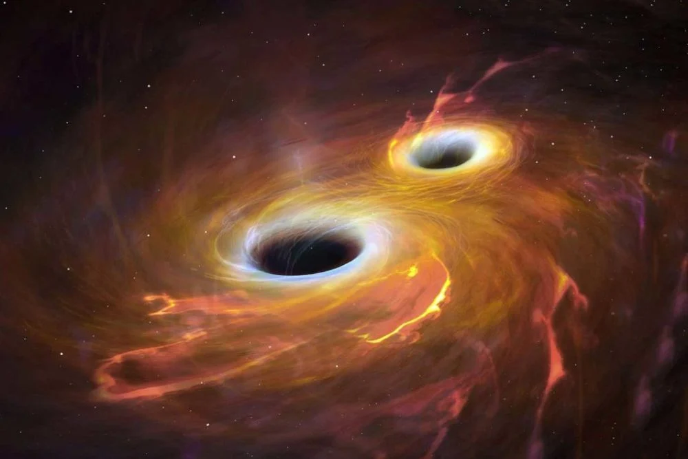 This artist's illustration shows two black holes merging. If the gravitational waves generated by the merger are uneven, it can create a recoiled black hole. Image Credit: NASA