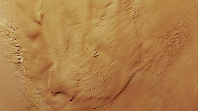 a reddish-orange rippled landscape, seen from over head