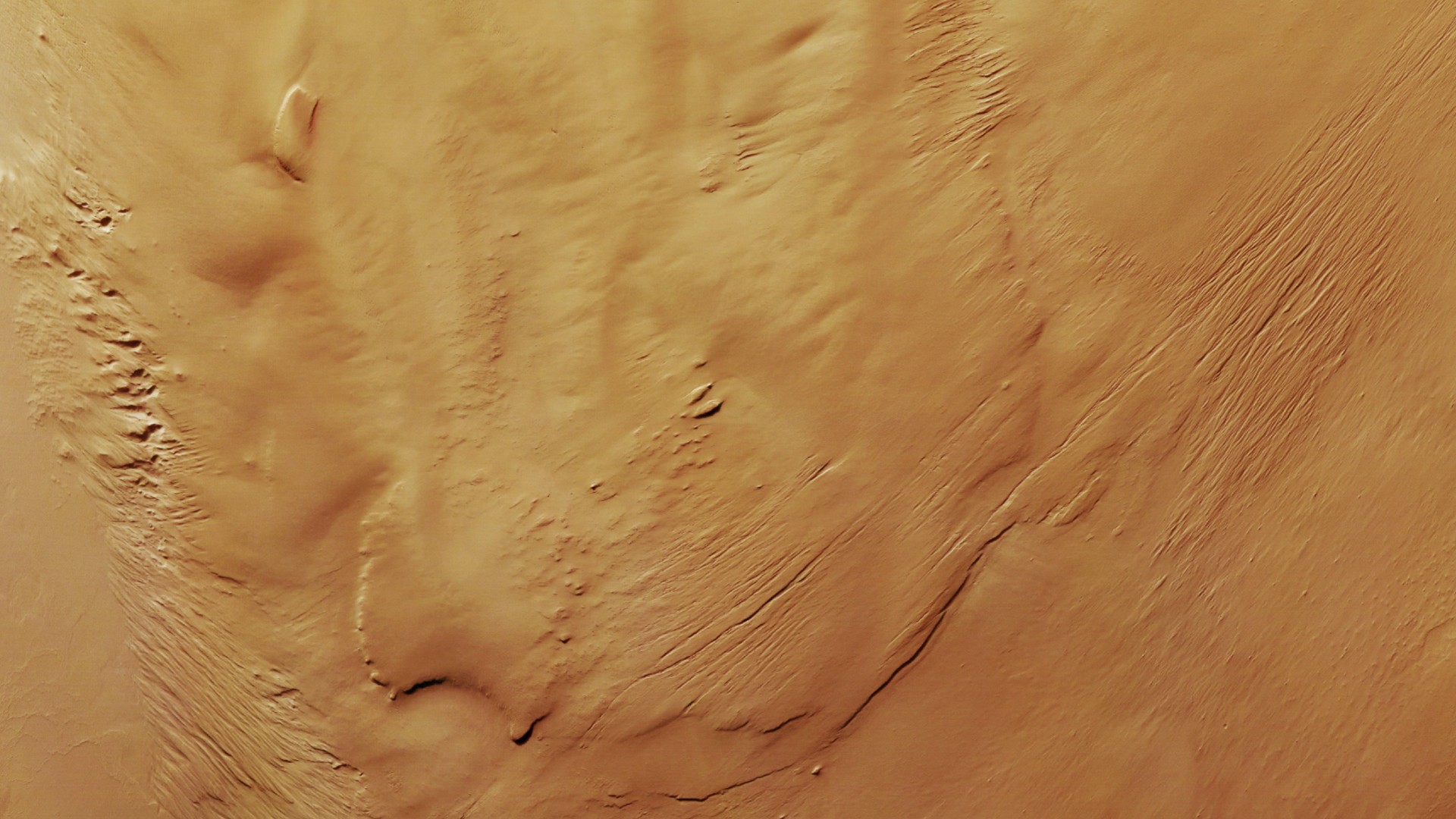 a reddish-orange rippled landscape, seen from over head