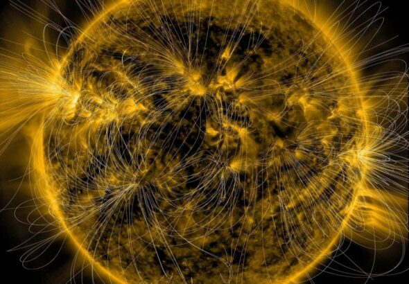 This is a depiction of the Sun’s magnetic fields overlaid on an image of the Sun captured in extreme ultraviolet light by NASA’s Solar Dynamics Observatory on March 12, 2016. The churning, rotating fields eventually break, and then reconnect to the Sun in a more stable and straightforward configuration, releasing flares. Image Credit: NASA/SDO/AIA/LMSAL
